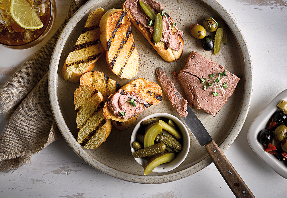Toasted halves of St Pierre Brioche Rolls on a plate with pate spread on two slices
