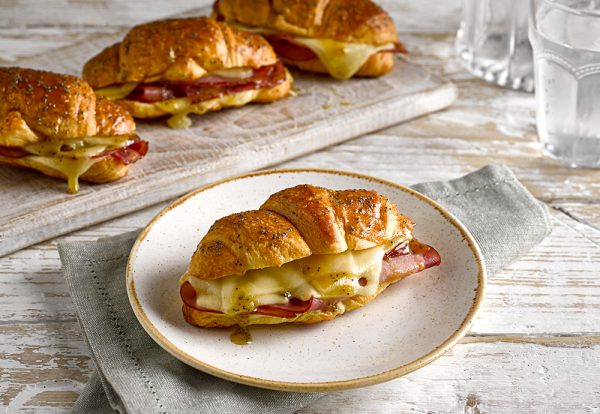 Ham & Cheese Croissant recipe featuring St Pierre All Butter Croissants on a table filled with melted cheese and ham